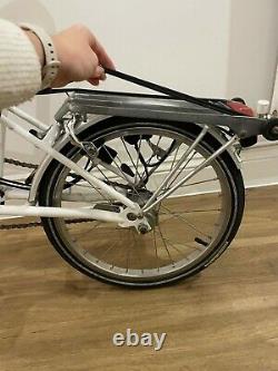 M3R folding Brompton in red and white. Front/rear dyno light, mudguard and rack